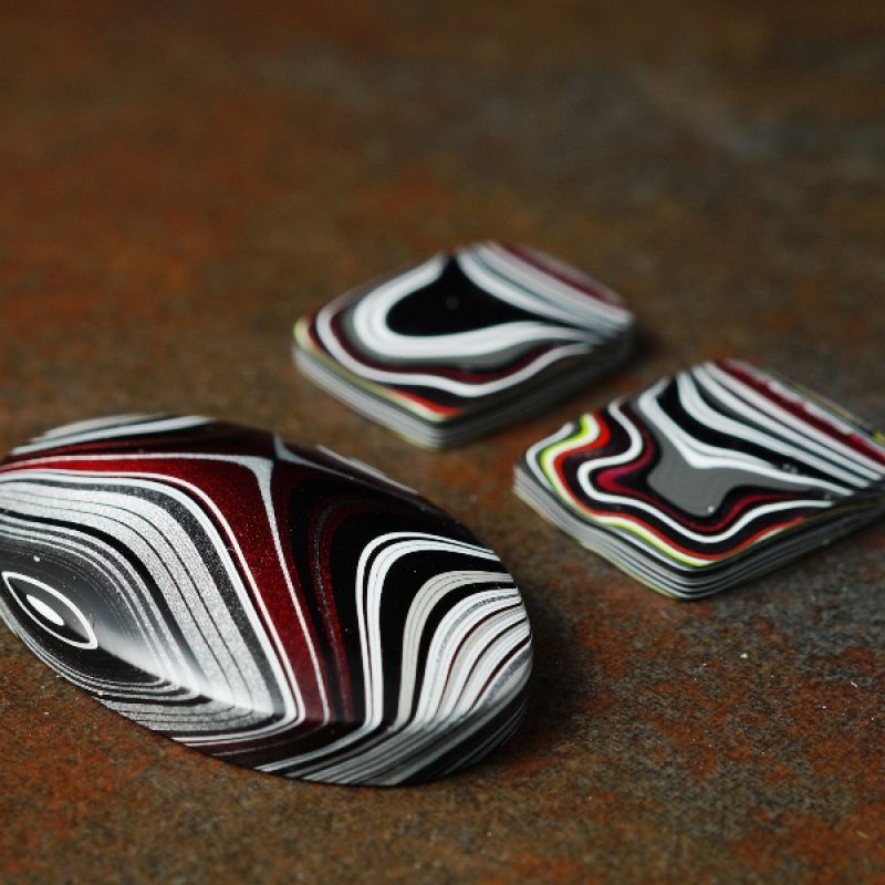 Collection of Fordite Cabochons, which forms the basis of this limited handcrafted range of bezel set  jewellery